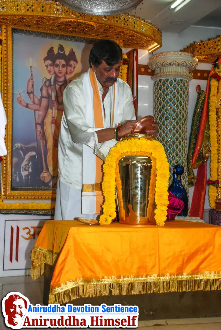 Sadguru Aniruddha Bapu in a serene of devotion with the sacred Haridra Kalash