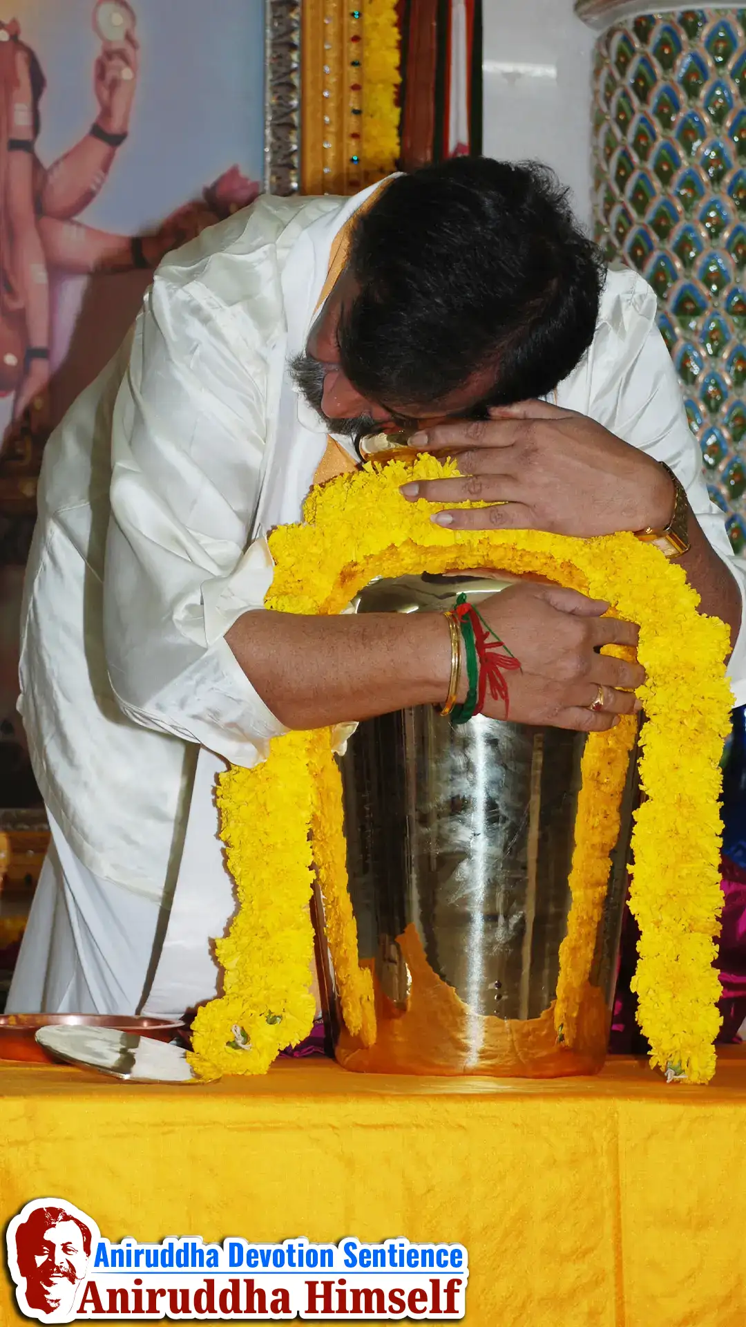 Sadguru Aniruddha Bapu lovingly embraces the sacred Haridra Kalash