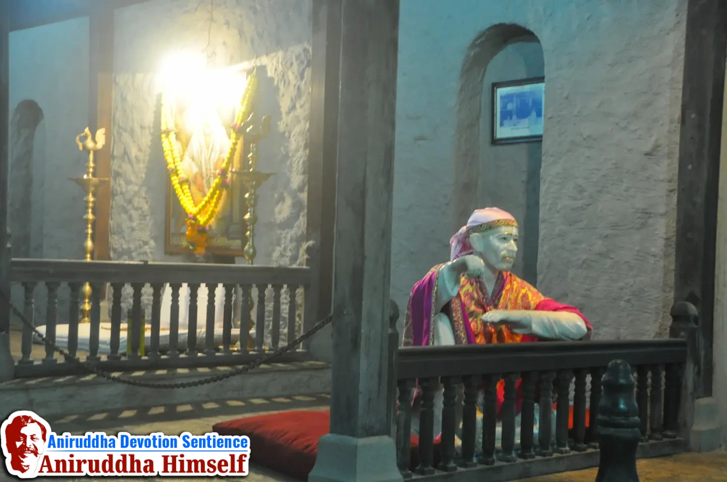Marble idol of Shree Sai Baba giving Udi at Dwarkamai at Shree Govidyapeetham