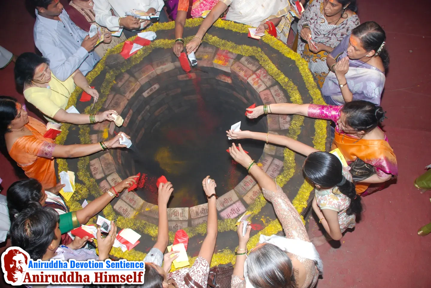 Shraddhavans offer Mangaldravya (a mixture of haldi, kumkum and abeer) to the sacred MahaSaraswati Vapi during Shree Varadachandika Prasannotsav at Shree Harigurugram in 2011.