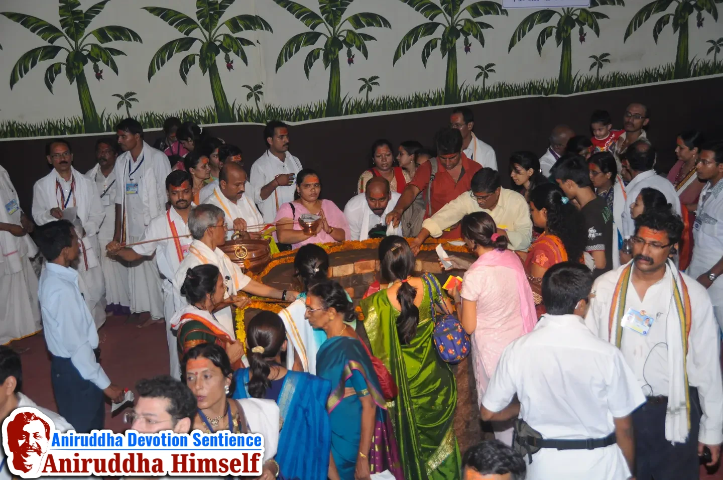 Shraddhavans offer Mangaldravya (a mixture of haldi, kumkum and abeer) to the sacred MahaSaraswati Vapi during Shree Varadachandika Prasannotsav at Shree Harigurugram in 2011.