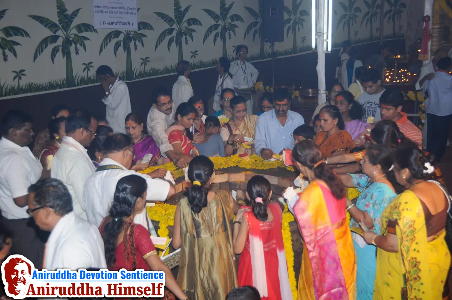 Shraddhavans offer Mangaldravya (a mixture of haldi, kumkum and abeer) to the sacred MahaSaraswati Vapi during Shree Varadachandika Prasannotsav at Shree Harigurugram in 2011.