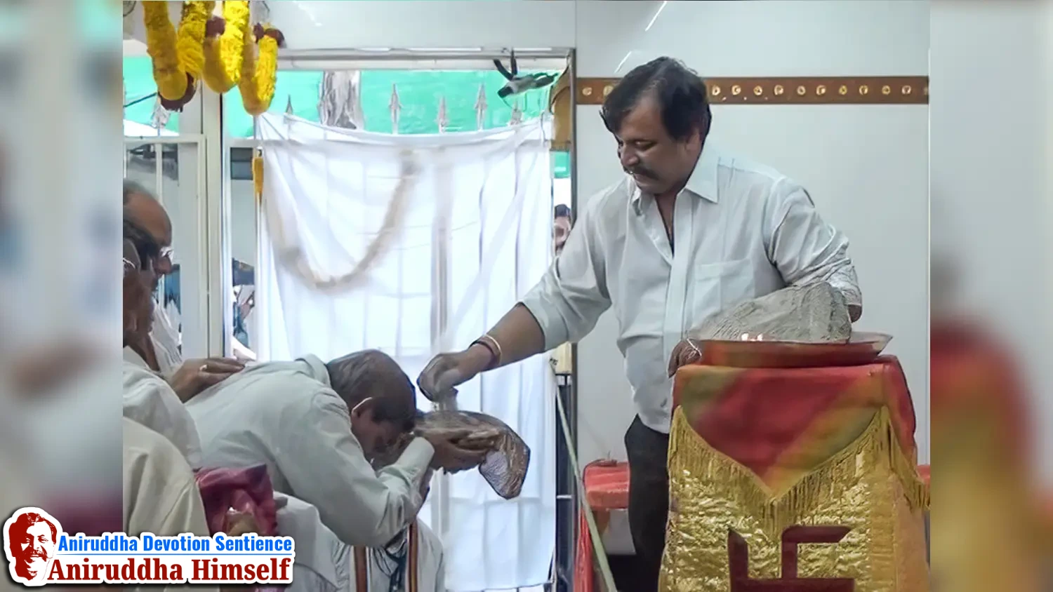 Shraddhavans, filled with reverence and gratitude, receive the sacred Udi from the hands of Sadguru Shree Aniruddha Bapu at Shree Gurukshetram.